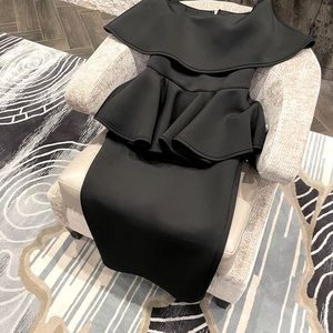 Item#2: Extravagant Black Peplum Dress